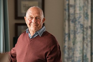 Closeup of senior man smiling at home