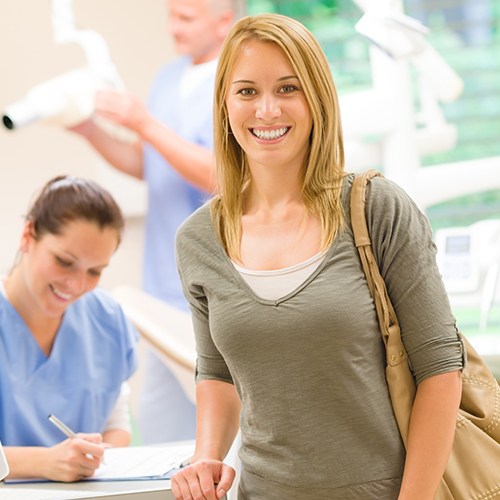 Woman smiling during dental office visit