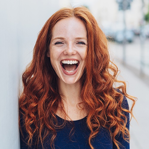 Woman sharing flawless smile after cosmetic dental bonding