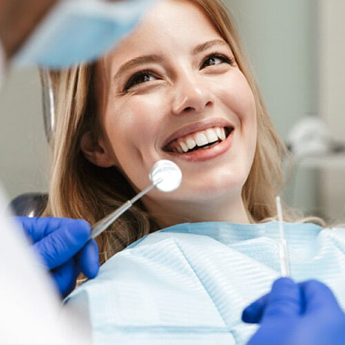 lady smiles at dentist