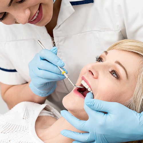 Dental patient receiving oral cancer screening