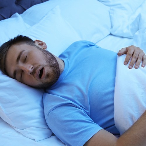 Young man with sleep apnea snoring