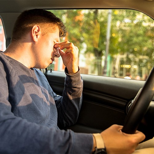 Tired man driving